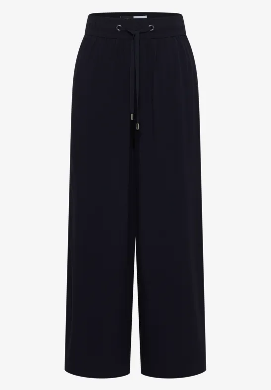 Schwarze, locker geschnittene, weite Hose mit hohem Bund.