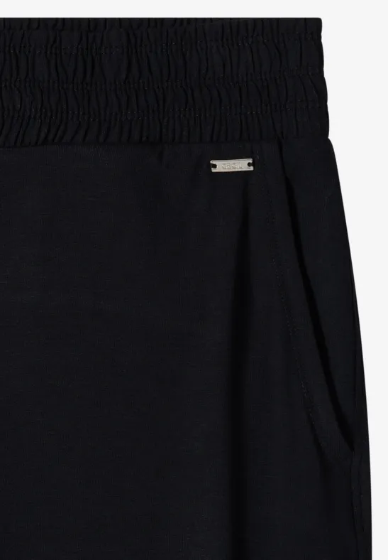 Schwarze Sweatpants mit elastischem Bund, Seitentasche und kleinem Metall-Label.