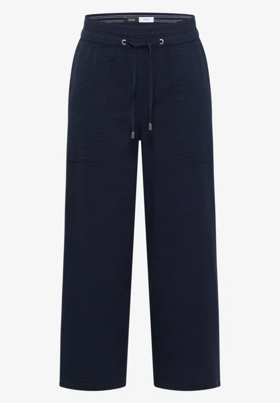 Donkerblauwe, losse broek met hoge taille, trekkoord, comfortabele pasvorm en grote voorzakken.