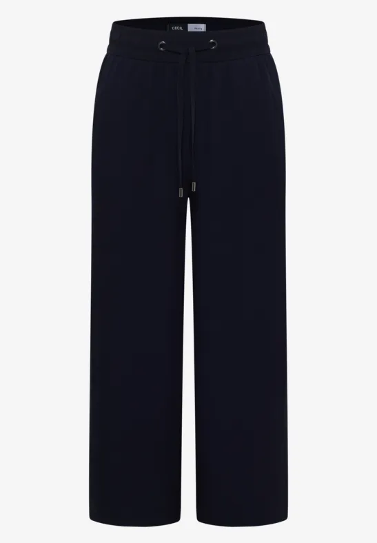 Schwarze weite Hose mit hohem Bund und Kordelzug, fließendes Material, lange gerade Beine.