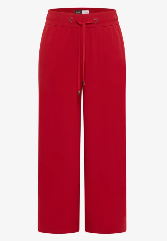 Rode wijdvallende broek met elastische tailleband en trekkoord, losse pasvorm.
