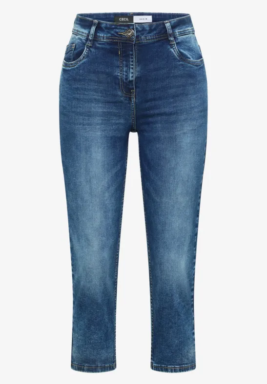 Damesjeans in mediumblauwe wassing, enkellang met subtiele used-look en slanke pasvorm.