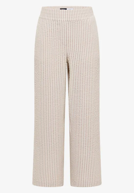 Weite beige Hose mit feinen roten Streifen, gerader Schnitt und hohem Bund.