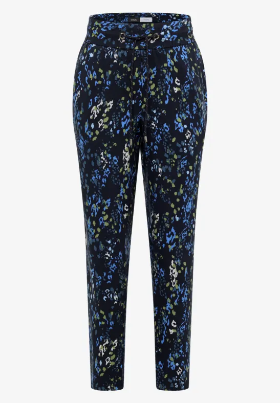 Damenhose mit geradem Bein, schwarzem Grund und blau-grünem abstrakten Blumenmuster.
