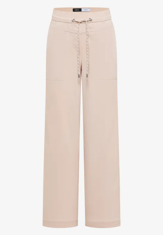 Beige, locker geschnittene Hose mit Kordelzug und aufgesetzten Taschen.