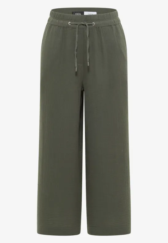 Olivgrüne, weite Stoffhose mit elastischem Bund und Kordelzug.