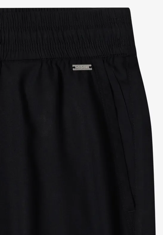 Zwarte, hooggetailleerde broek met elastische tailleband en zijzakken van soepel jersey.