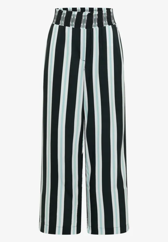Zwart-witte wijde broek met verticale strepen.