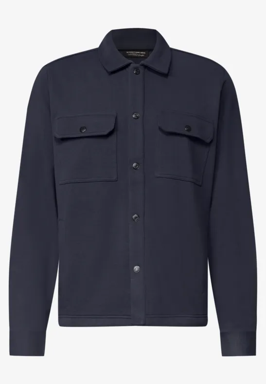 Dunkelblaue Hemdjacke mit zwei Brusttaschen, Knopfleiste, Hemdkragen und langen Ärmeln.