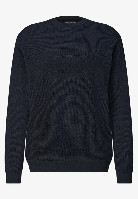 Donkerblauwe effen trui met ronde hals, lange mouwen en geribbelde boorden voor een strakke look.