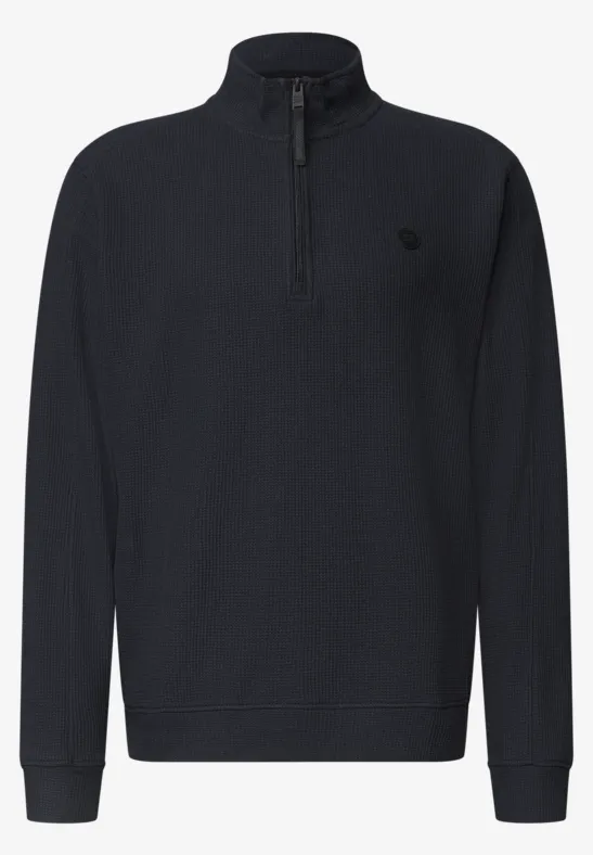 Pull-over noir à manches longues, col montant avec demi-fermeture éclair, design uni et épuré.