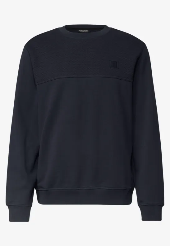 Pull bleu foncé uni à col rond, manches longues et coupe classique.