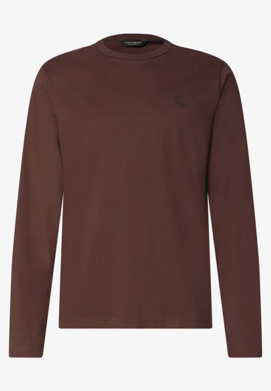 Ein schlichtes, braunes Langarmshirt aus Baumwollmischung.