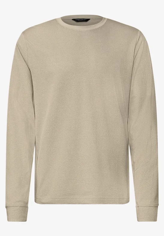 Effen beige shirt met lange mouwen en ronde hals, frontaal weergegeven.