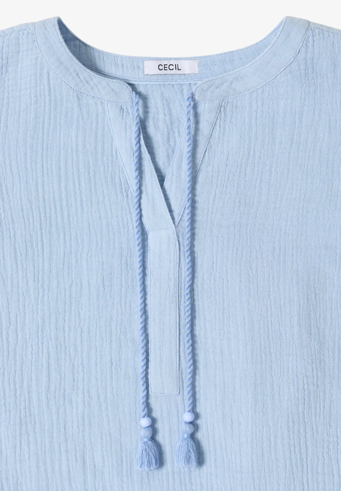 Hellblaue Tunika-Bluse mit V-Ausschnitt und Kordelbändern