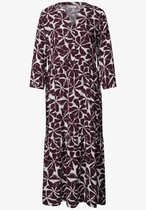 Langes, dunkelrotes Maxikleid mit weißem Blattmuster und V-Ausschnitt.