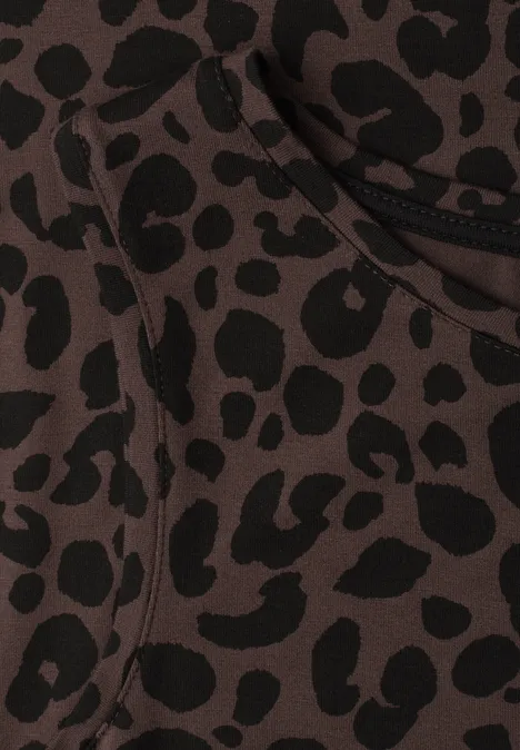 Robe midi en jersey imprimé léopard molten earth Gros plan sur un tissu marron à motif léopard noir.