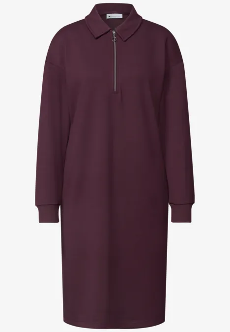 Robe polo bordeaux simple à manches longues avec fermeture éclair.