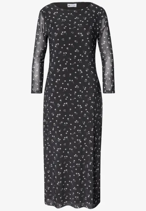 Robe midi noire ajustée à manches longues transparentes et imprimé floral blanc discret.