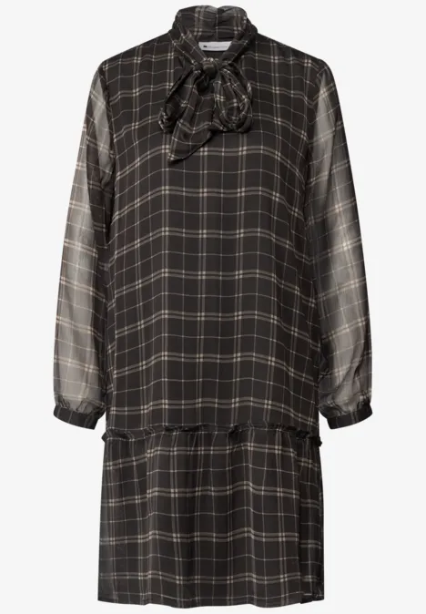 Knielanges Tunikakleid mit Schleifendetail black coffee Schwarzes kariertes, langärmeliges Kleid mit Schleife am Ausschnitt und lockerem Fall.