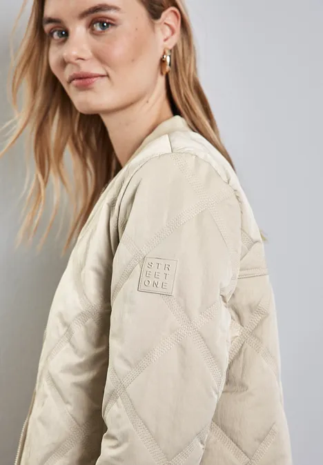 Blouson met doorgestikt patroon pearly sand