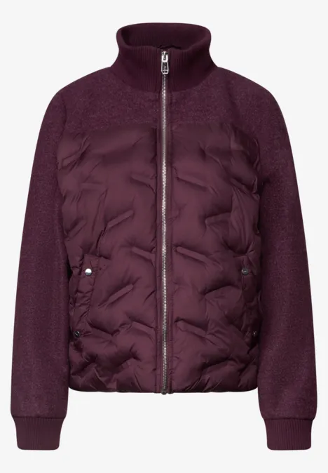 Veste femme violet foncé à devant matelassé, manches en maille et fermeture éclair