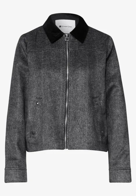 Veste grise chinée à fermeture éclair et col noir.