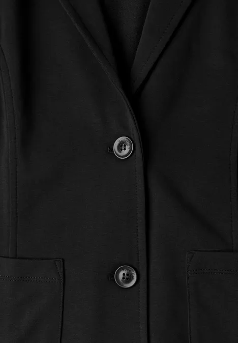 Blazer basique uni Black Schwarzer Blazer mit zwei Knöpfen und seitlichen Taschen.