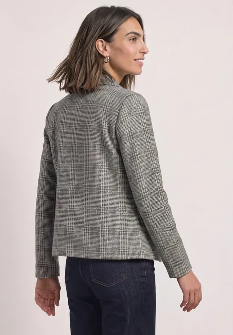 Blazer mit Karomuster und Knöpfen Black Frau trägt grauen Karoblazer und Jeans, blickt seitlich nach links.