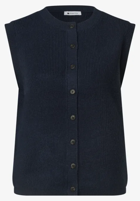 Mouwloze gebreide gilet in marineblauw met knopen.