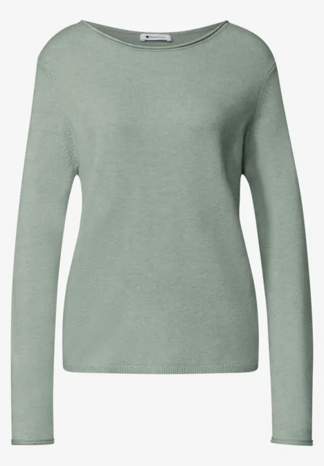 Pull pastel vert à manches longues avec encolure ronde et coupe épurée.