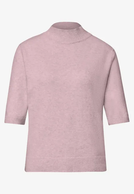 Rosa Kurzarm-Strickpullover mit Rollkragen, weicher Stoff und lockere Passform.