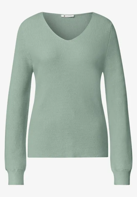 Hellgrüner Langarm-Pullover mit V-Ausschnitt für Damen.