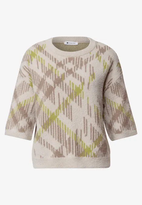 Pull court beige à manches courtes, col rond et motif argyle abstrait en beige et vert amande.