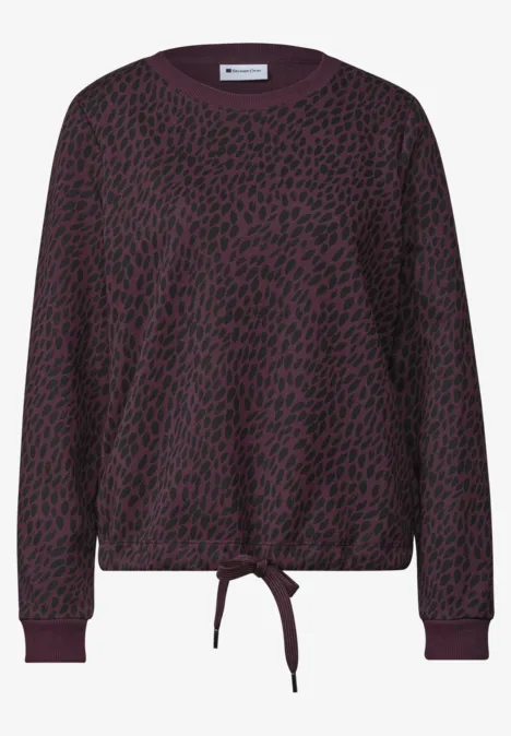 Lässiger, langärmliger Pullover in Dunkelviolett mit schwarzem Leopardenmuster und Kordelzug am Saum.