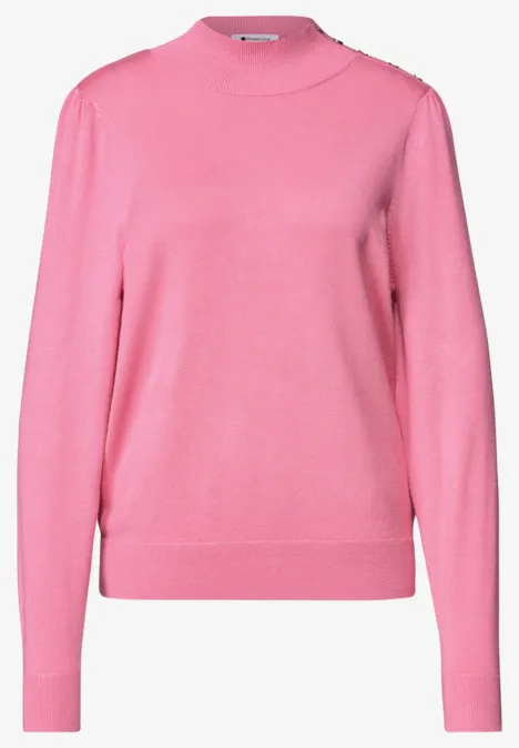Rosa Damenpullover mit Rundhalsausschnitt und langen Ärmeln.