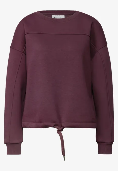 Lila Sweatshirt mit Rundhalsausschnitt und Tunnelzug am Saum, lange Ärmel und schlichte Passform.