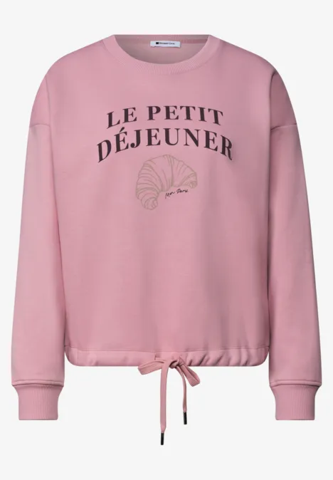 Rosa Sweatshirt mit Aufdruck 'Le Petit Déjeuner' und stilisiertem Croissant
