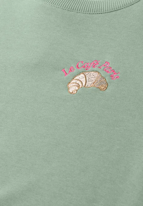 Sweatshirt met ronde hals en borduursel eucalyptus green Hellgrünes Shirt mit pinkem Schriftzug 'Le Café Paris' und zwei gestickten Croissants.