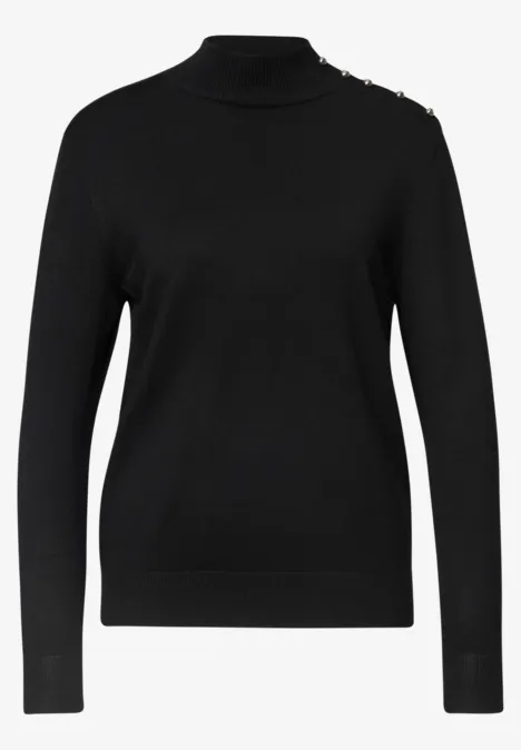 Schwarzer, langer Pullover mit Rollkragen und langen Ärmeln.