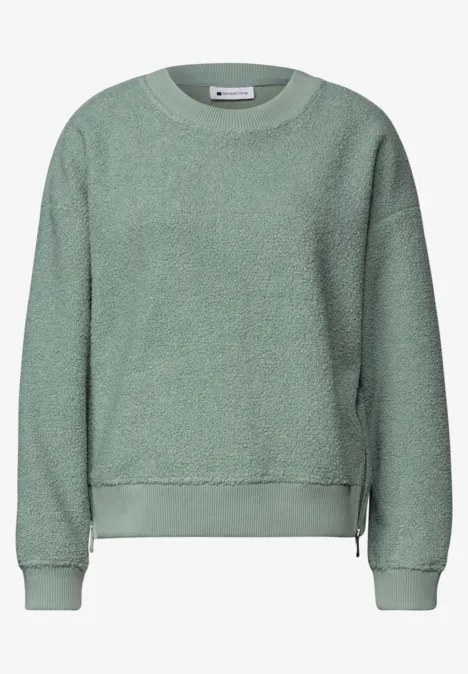 Hellgrünes Fleece-Sweatshirt mit Rundhalsausschnitt, langen Ärmeln und seitlichen Reißverschlüssen.