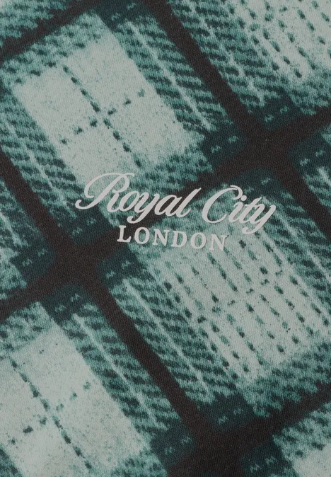 Karomuster aus gestricktem Stoff in Grautönen, darüber weiße Schrift 'Royal City LONDON'.