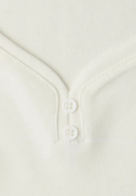 Top mit Knopfdetail off white Top mit Knopfdetail off white
