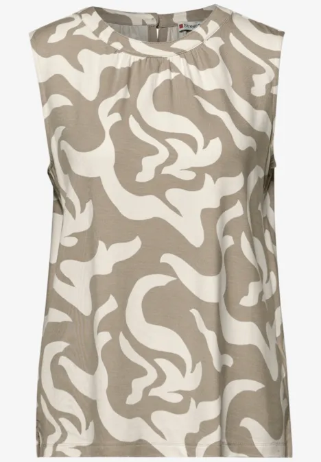 Mouwloos topje in beige met abstracte witte print.