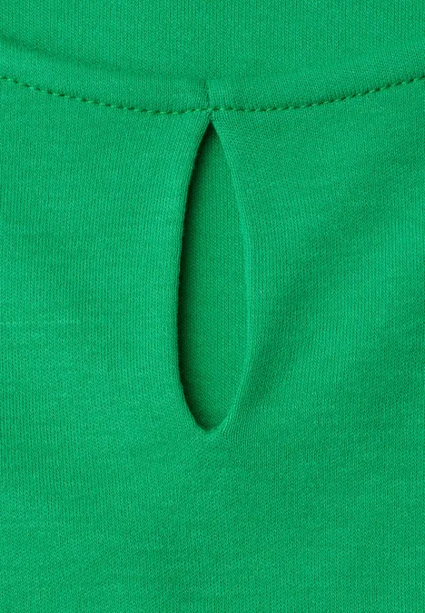 Groen textiel met kleine verticale opening