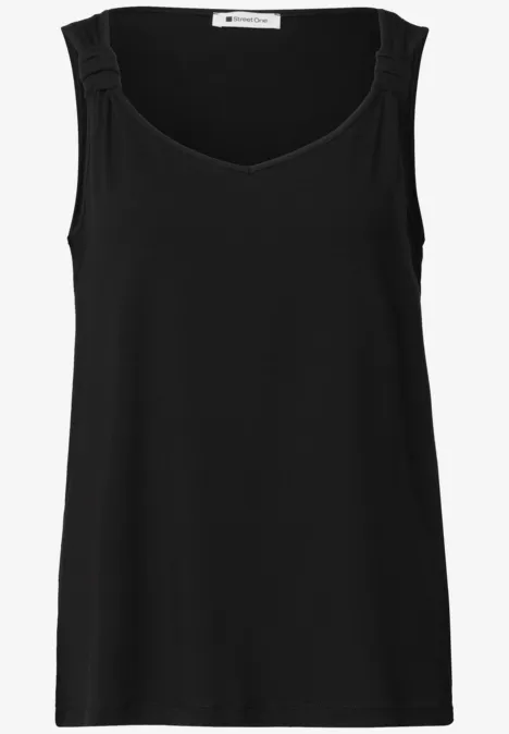 Effen zwarte dames tanktop zonder mouwen, met brede schouderbanden en ronde hals.