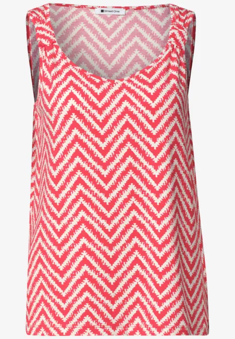 Top avec col en V et détail de nœuds salsa red Haut femme sans manches rouge et blanc à motif chevrons et encolure V.