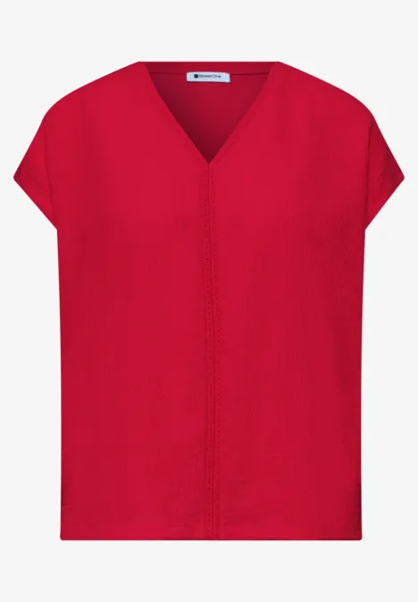 Rode, losvallende top met V-hals, korte mouwen en centrale naad.