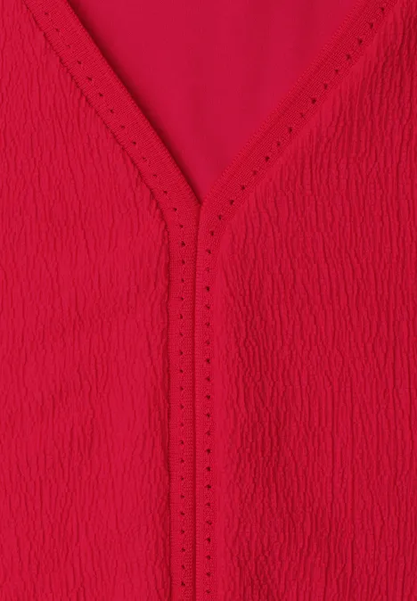 Rood, gestructureerd V-hals topje van licht materiaal.