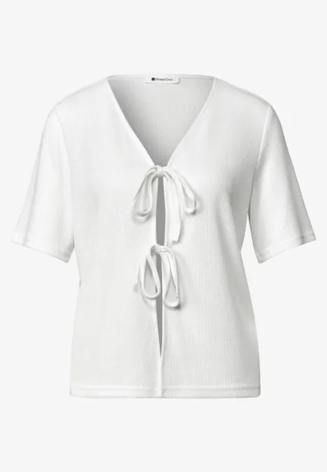 Veste en maille avec rubans off white Haut blanc femme manches courtes, col V avec deux nœuds décoratifs sur le devant.
